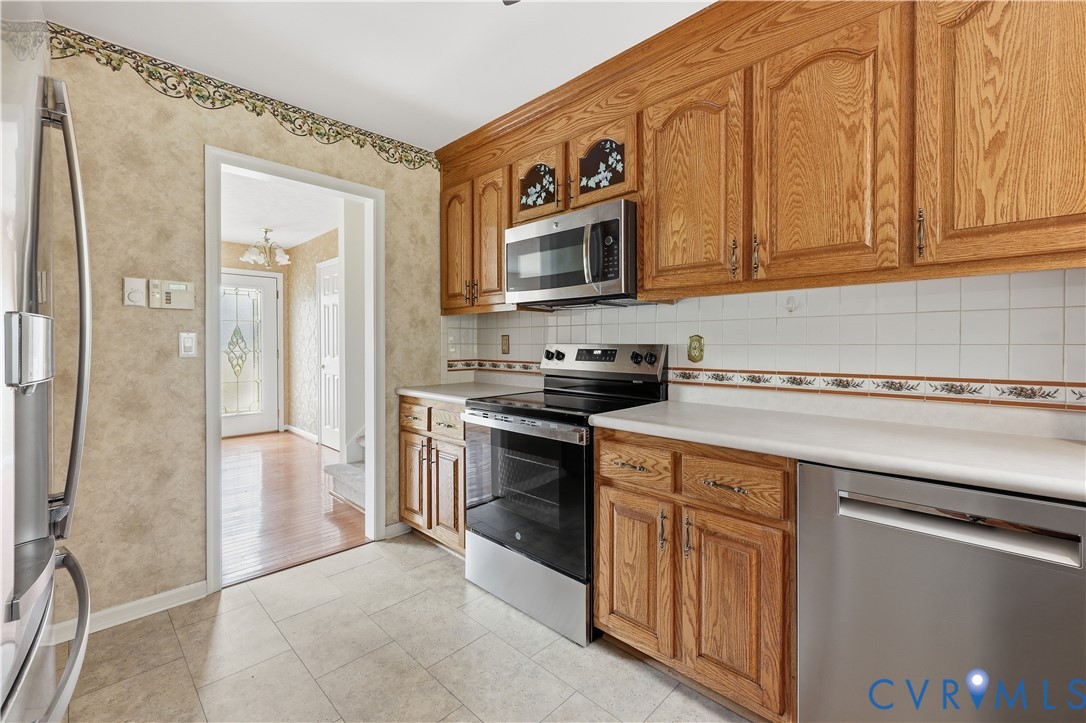 22925 River Road Petersburg, VA 23803 - Photo 18 of 27 Kitchen featuring wood-finish cabinetry, stainless
