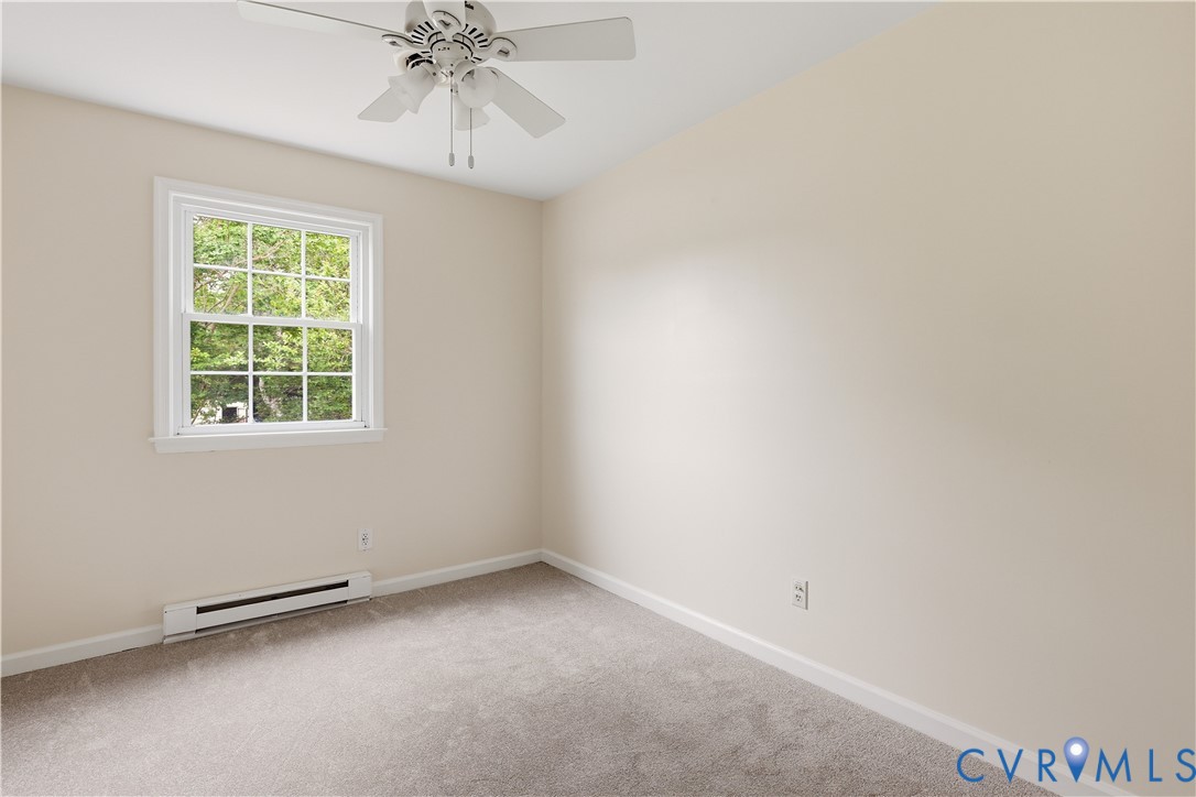22925 River Road Petersburg, VA 23803 - Photo 20 of 27 Neutral-toned room featuring a white ceiling fan w