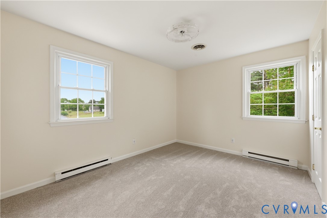 22925 River Road Petersburg, VA 23803 - Photo 22 of 27 Neutral wall paint with two white-framed windows