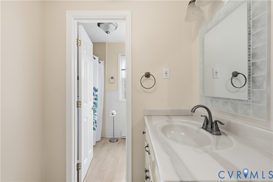 22925 River Road Petersburg, VA 23803 - Photo 26 of 27 Bathroom vanity with an integrated sink, a dark-to