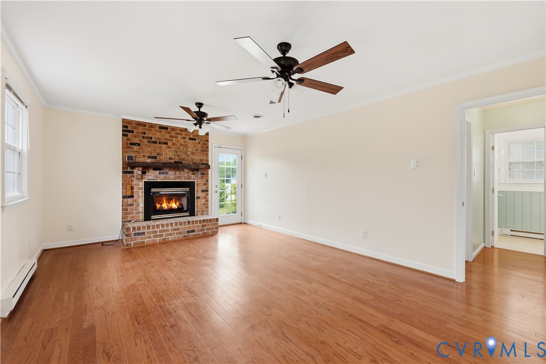 22925 River Road Petersburg, VA 23803 - Photo 7 of 27 Living area featuring wood-finish flooring, a bric