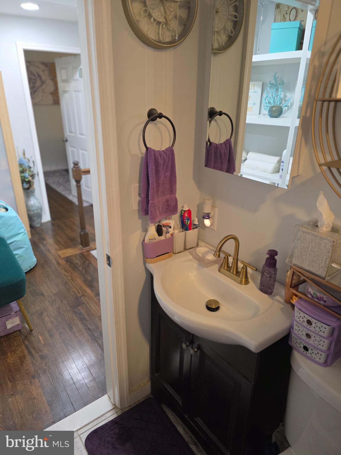 1808 Swansea Road Baltimore, MD 21239 - Photo 13 of 24 a bathroom with a sink and a mirror