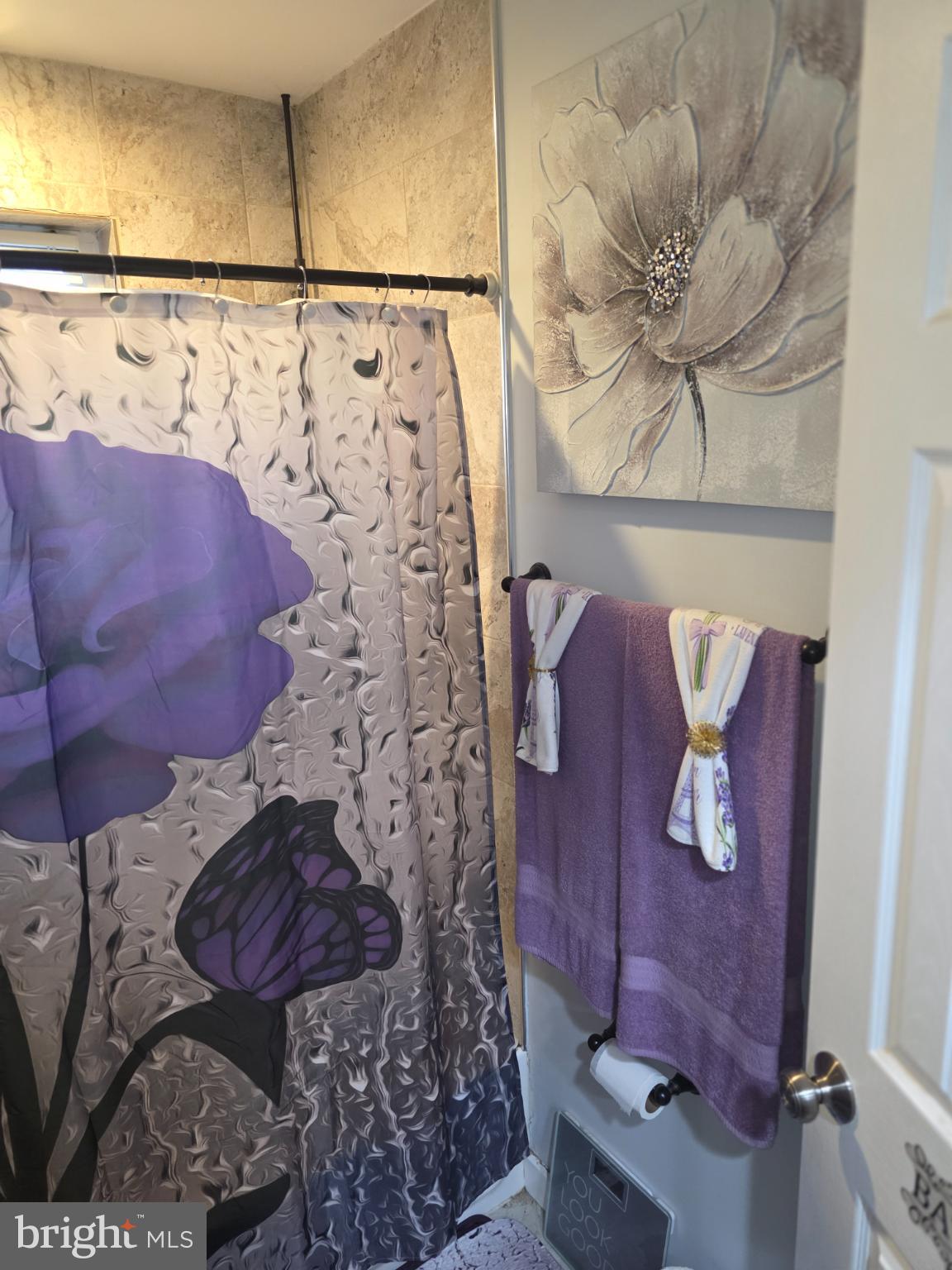 1808 Swansea Road Baltimore, MD 21239 - Photo 14 of 24 a bathroom with a toilet sink and shower curtain