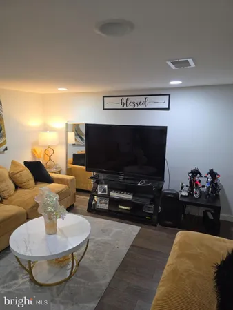 a living room with furniture and a rug