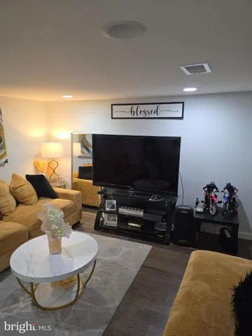 a living room with furniture and a rug