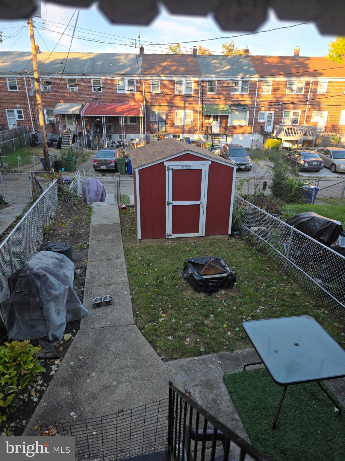 1808 Swansea Road Baltimore, MD 21239 - Photo 24 of 24 a view of a chairs and table in patio with a yard