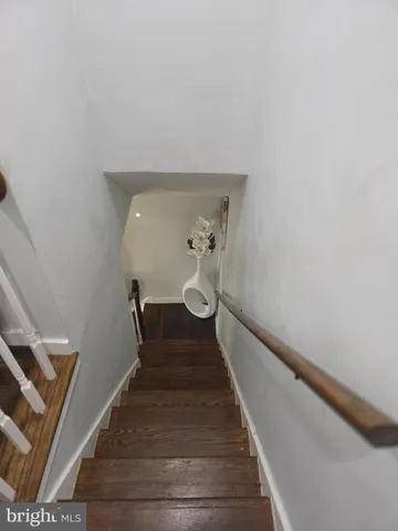 a bedroom with a bed and mirror