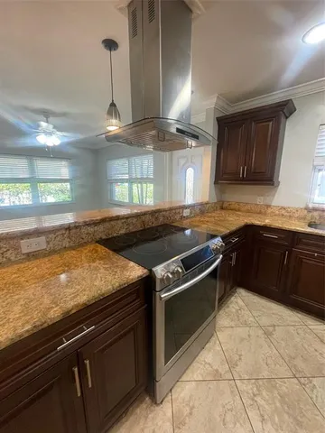 a kitchen with a stove and a sink