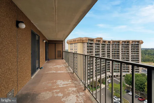 a view of balcony with wooden floor