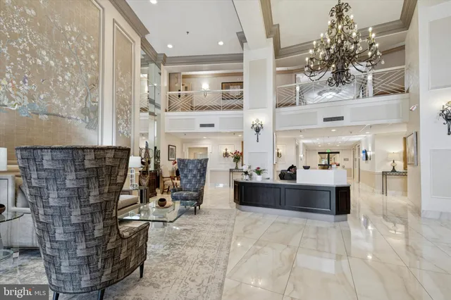a living room with fireplace furniture and a potted plant