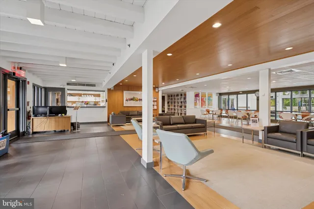 a view of a living room and livingroom with furniture wooden floor and a rug