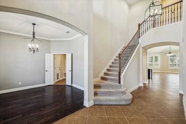 a view of wooden floor and windows in a room