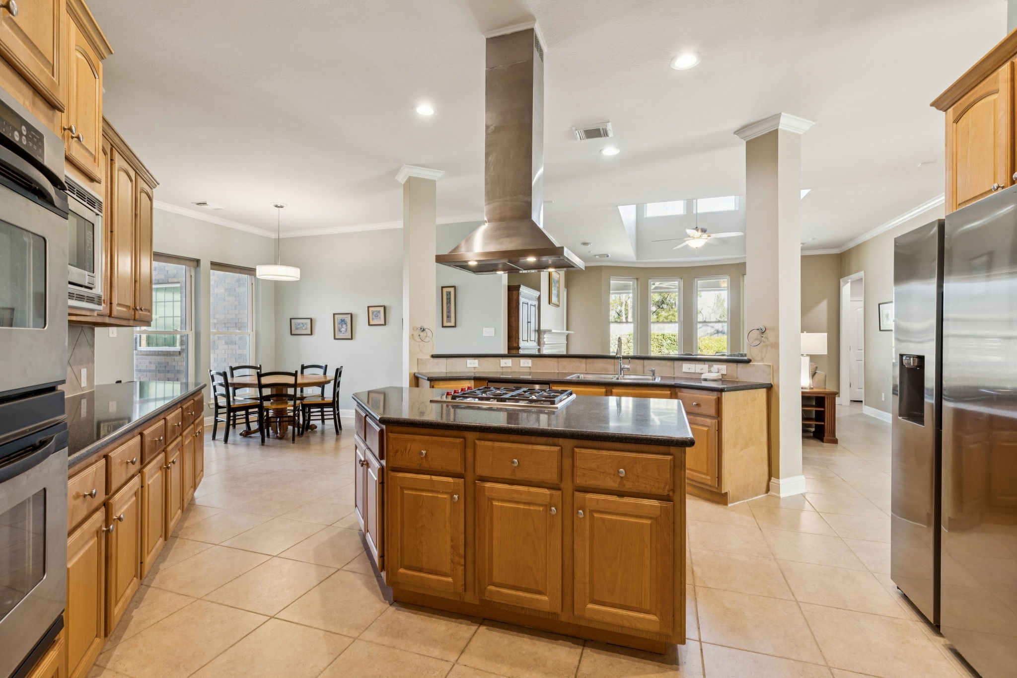 2809 Cedar Ridge Trail Friendswood, TX 77546 - Photo 3 of 33 ISLAND KITCHEN WITH SS VENT HOOD, DESK, BREAKFAST BAR