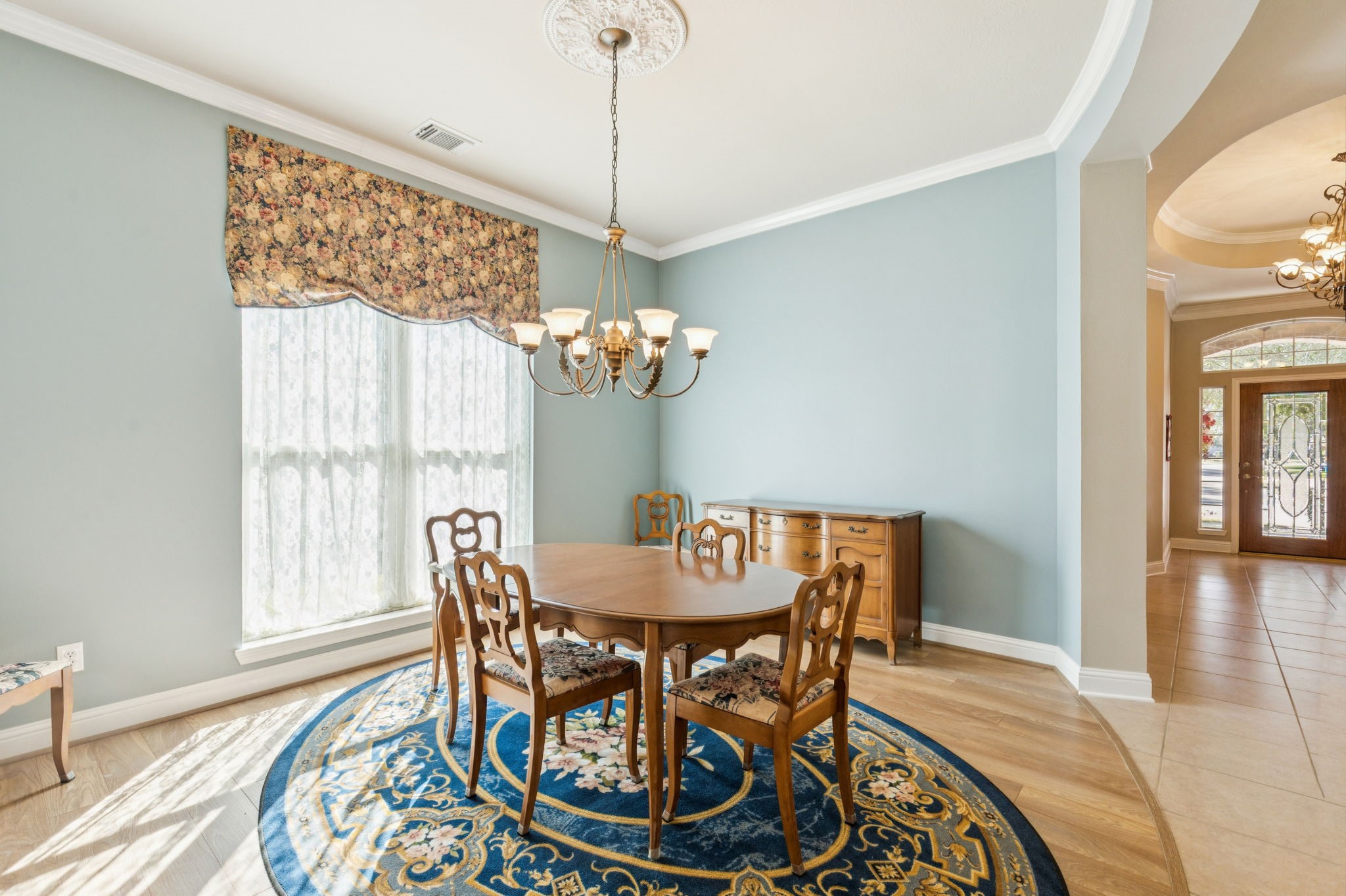 2809 Cedar Ridge Trail Friendswood, TX 77546 - Photo 6 of 33 HUGE DINING ROOM WITH CHANDELIER, CURVED WALL ENTRY, LAMINATE WOOD FLOOR, CORWN MOULDING
