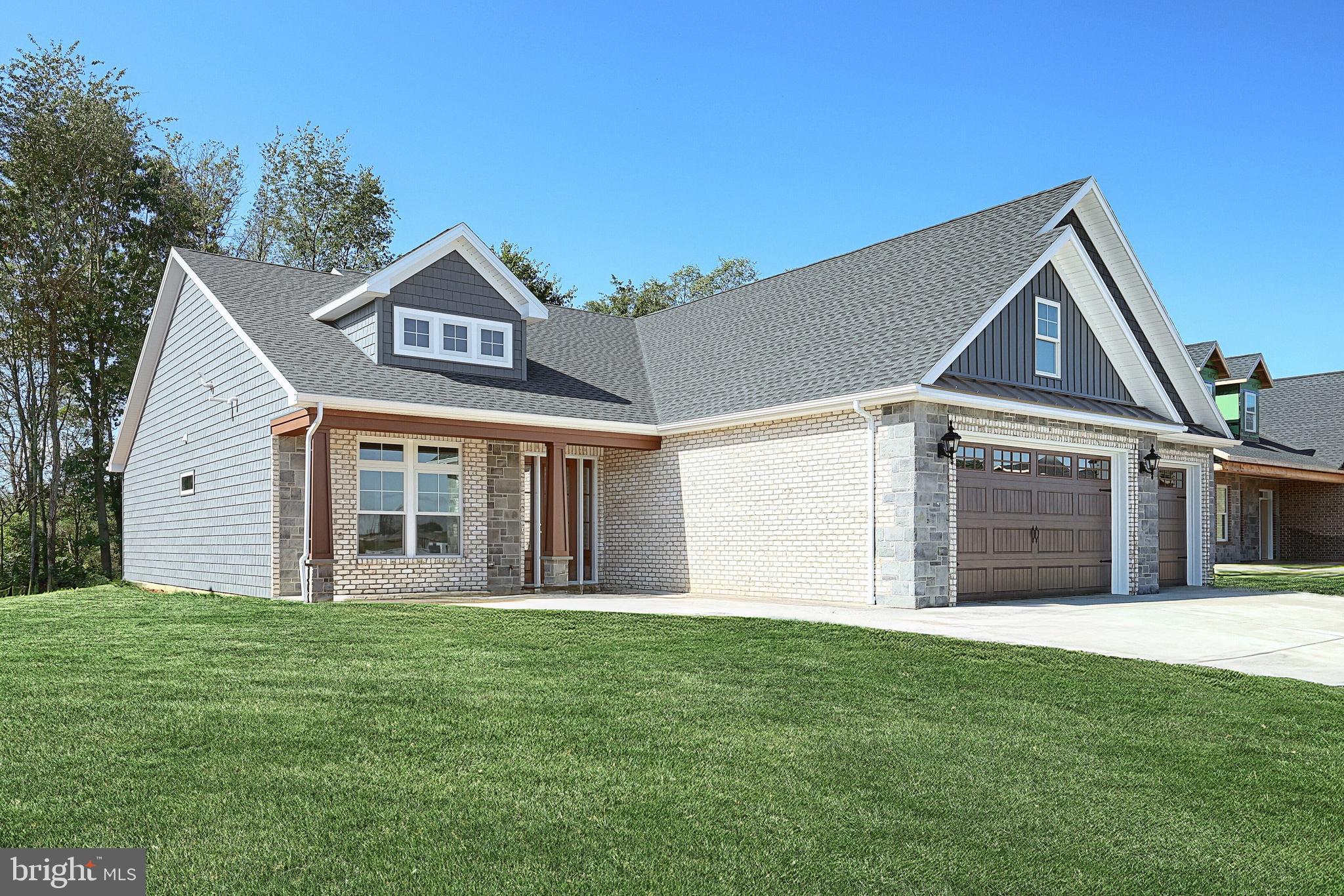 567 Lumber Street Littlestown, PA 17340 - Photo 18 of 62 a front view of a house with a garden