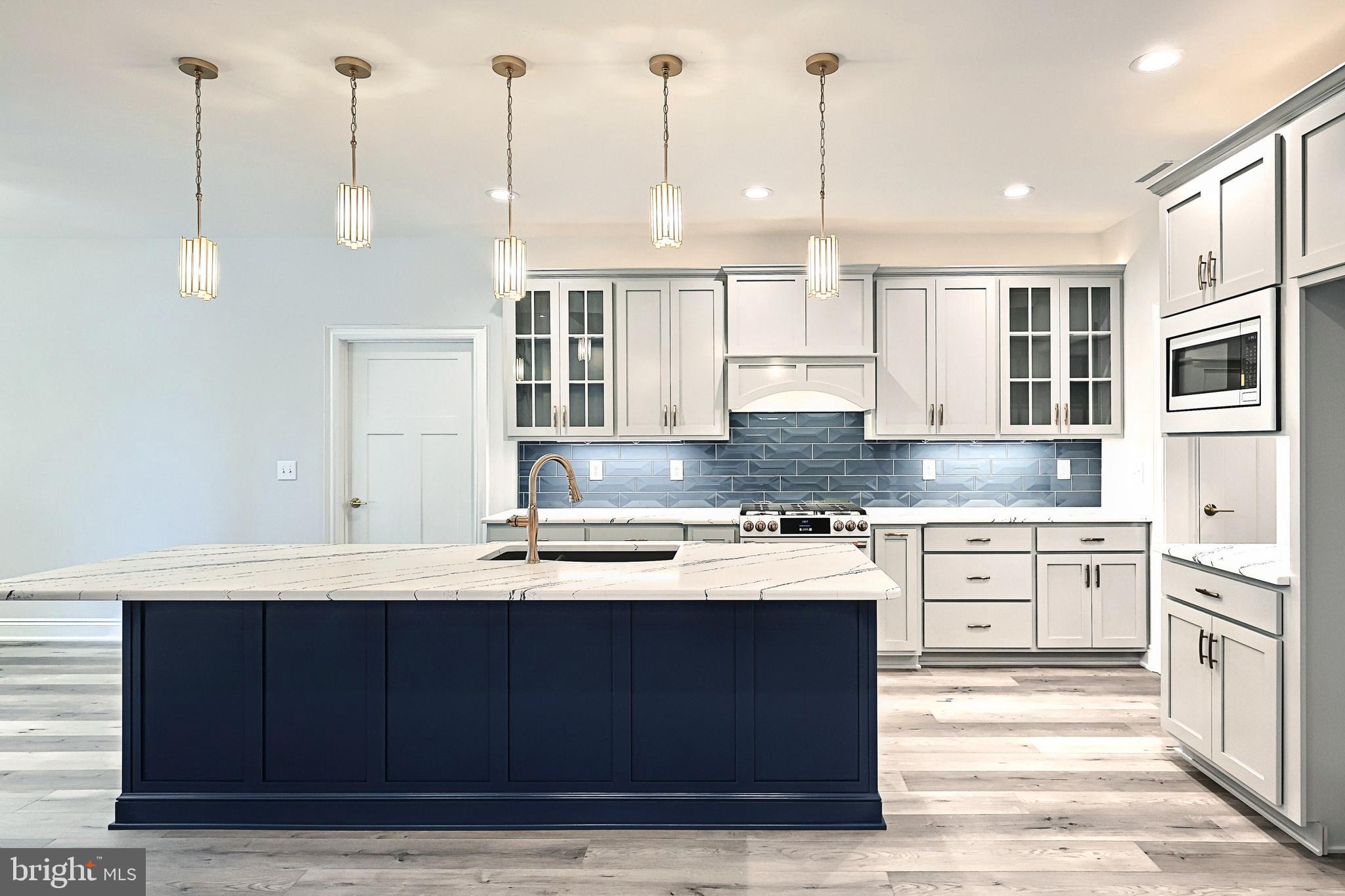 567 Lumber Street Littlestown, PA 17340 - Photo 25 of 62 a kitchen with a refrigerator sink and cabinets