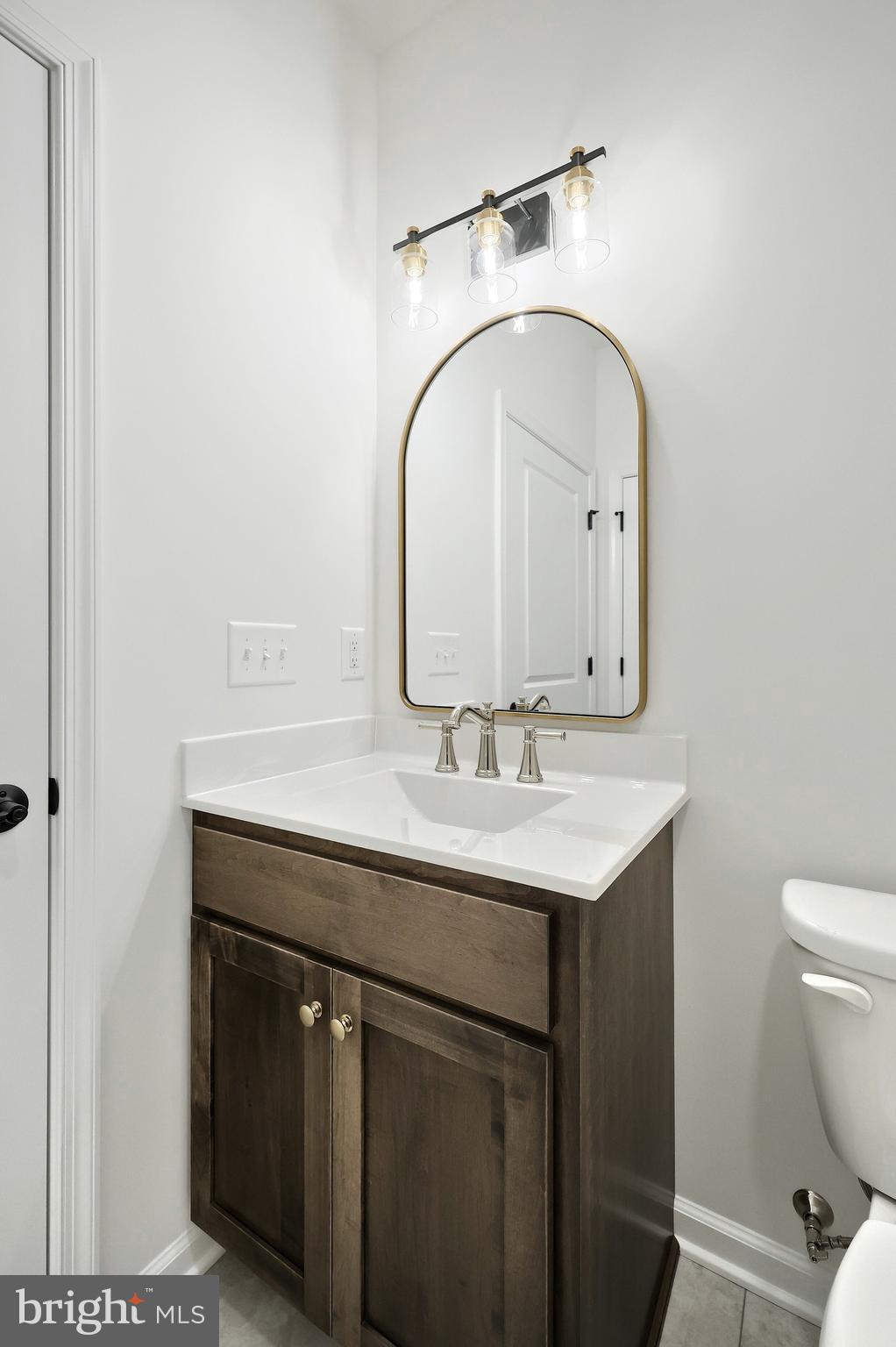 567 Lumber Street Littlestown, PA 17340 - Photo 56 of 62 a bathroom with a sink a toilet and a mirror