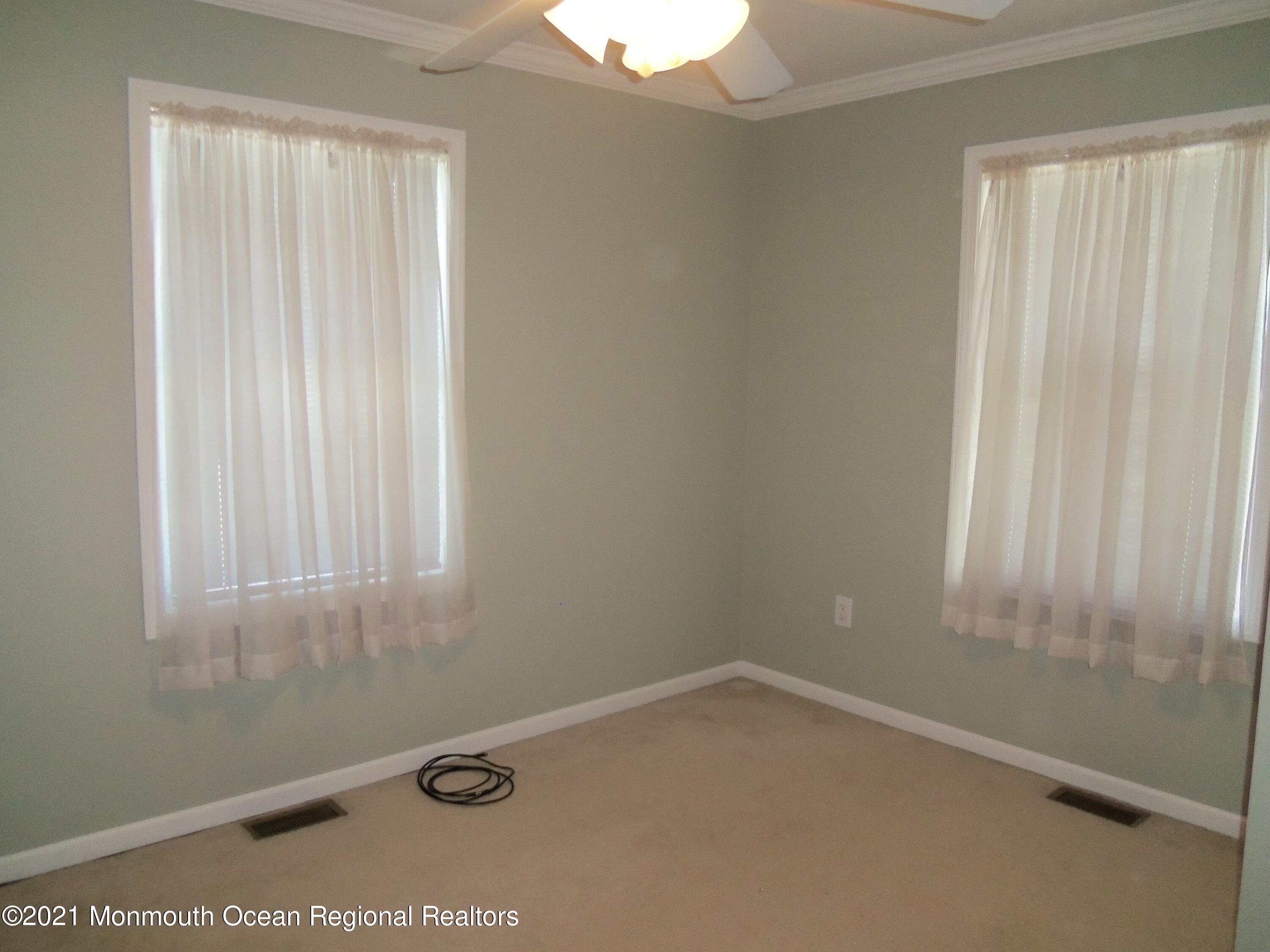 338 Pitcairn Road Brick, NJ 08723 - Photo 14 of 24 an empty room with a window