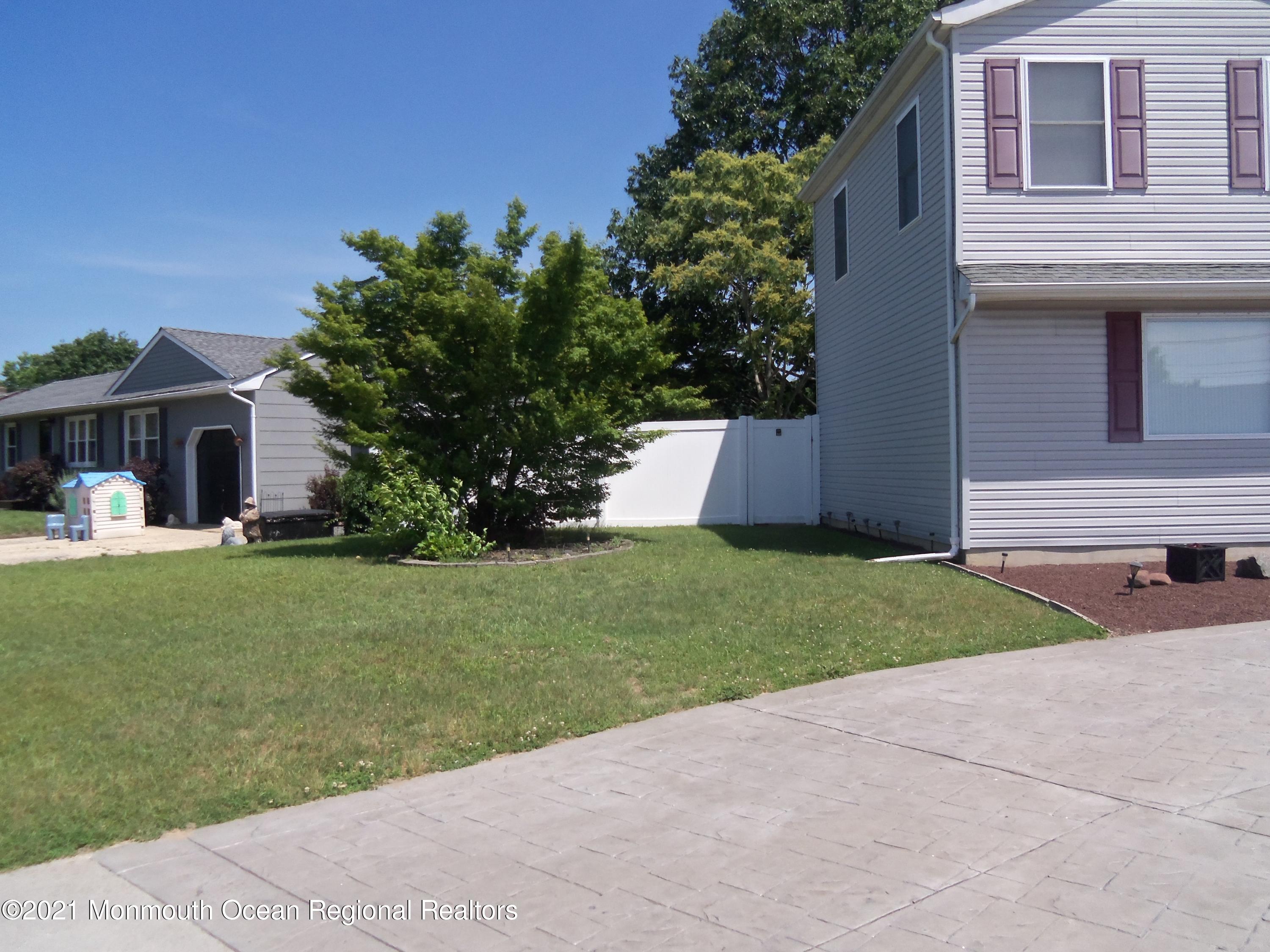 338 Pitcairn Road Brick, NJ 08723 - Photo 21 of 24 a front view of house with yard and green space