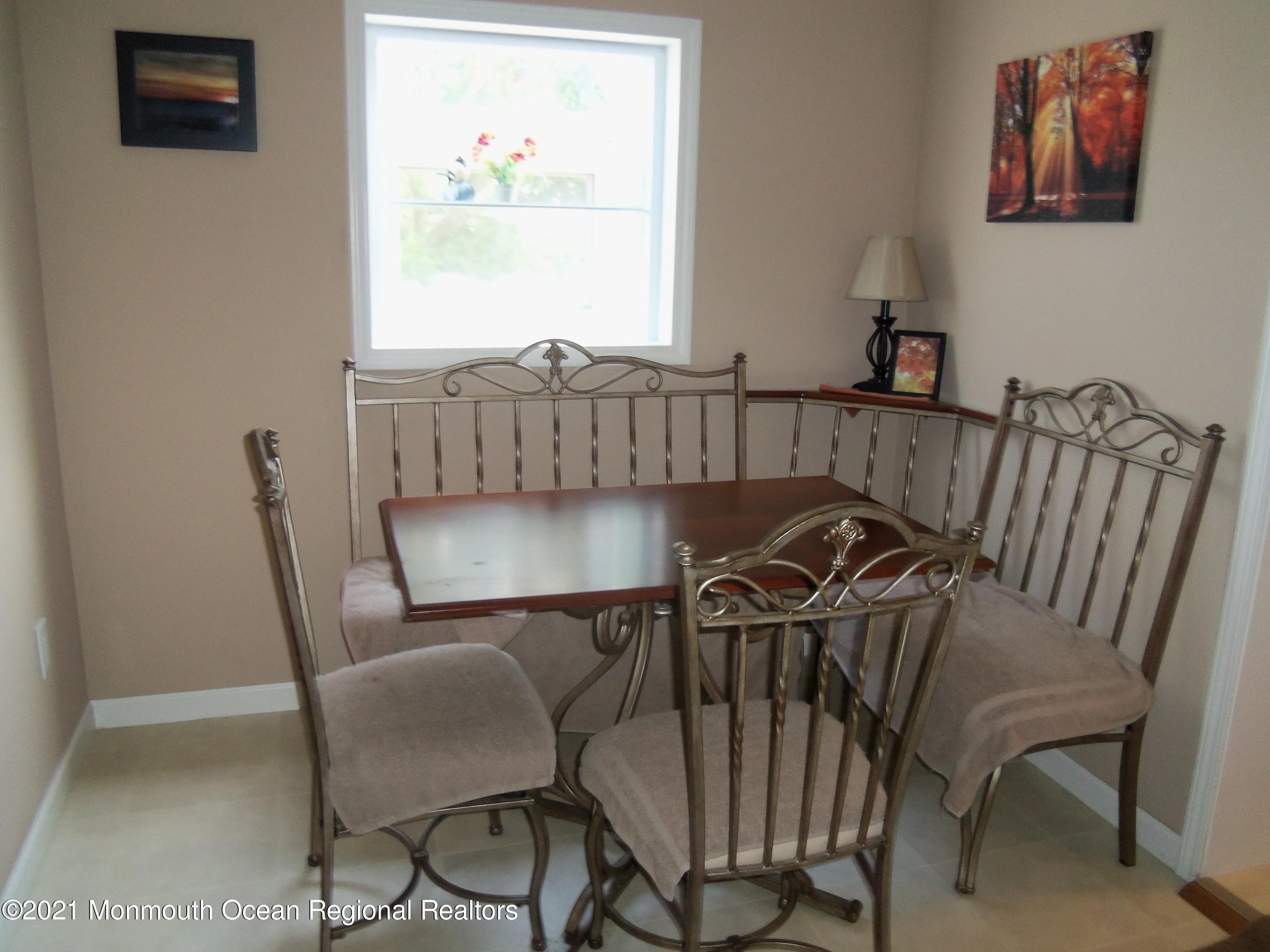 338 Pitcairn Road Brick, NJ 08723 - Photo 4 of 24 a view of a dining room with furniture and wooden floor
