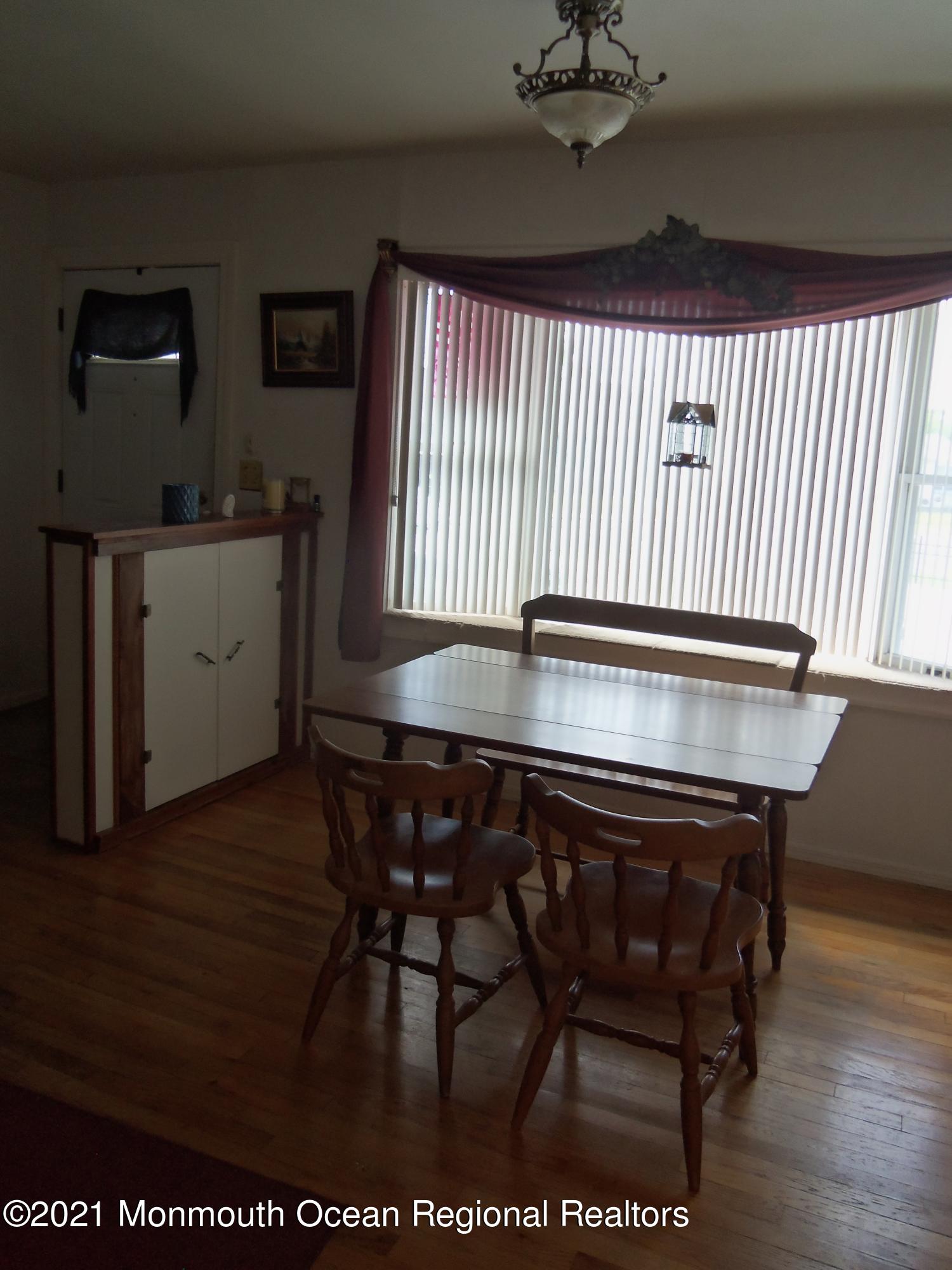 338 Pitcairn Road Brick, NJ 08723 - Photo 8 of 24 a kitchen with a sink cabinets and wooden floor