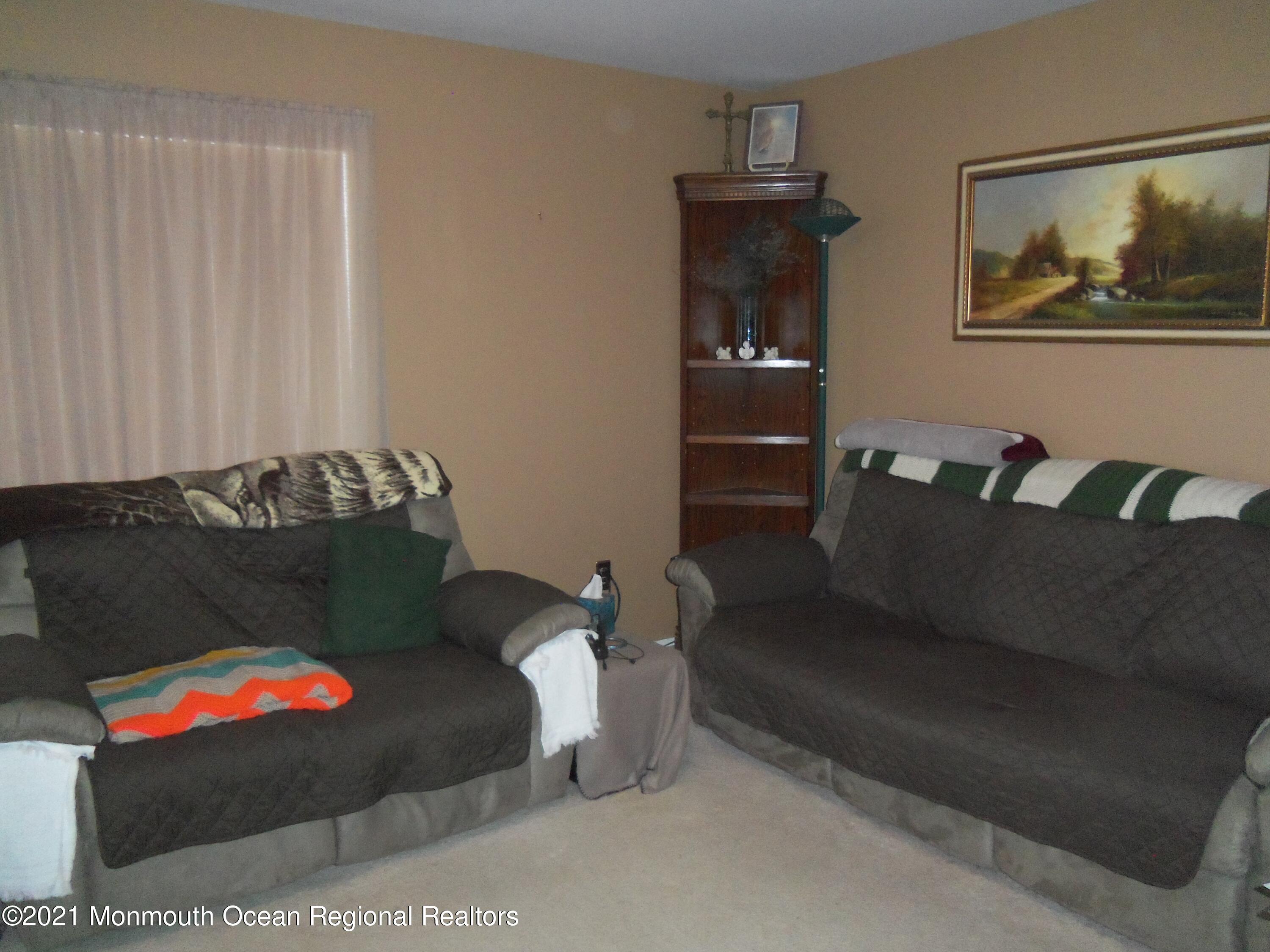 338 Pitcairn Road Brick, NJ 08723 - Photo 9 of 24 a living room with furniture and a couch
