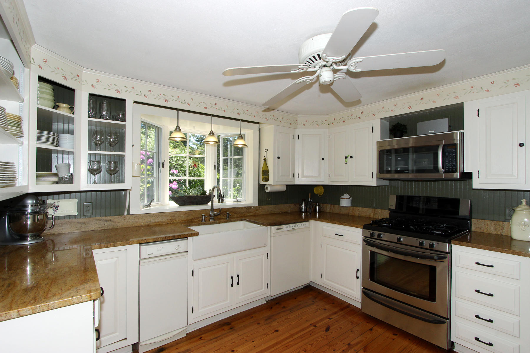 176 Gorham Road Harwich Port, MA 02646 - Photo 8 of 36 a kitchen with a stove a sink and a microwave