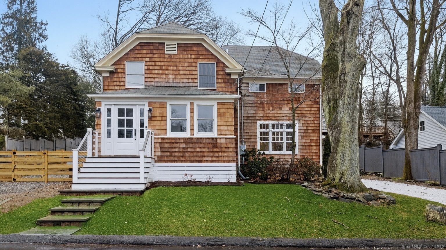 22 Harstrom Place Norwalk, CT 06853 - Photo 1 of 26 a front view of a house with a yard