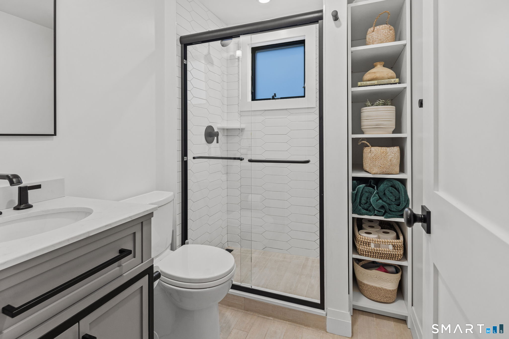 22 Harstrom Place Norwalk, CT 06853 - Photo 14 of 26 a bathroom with a granite countertop toilet sink and mirror