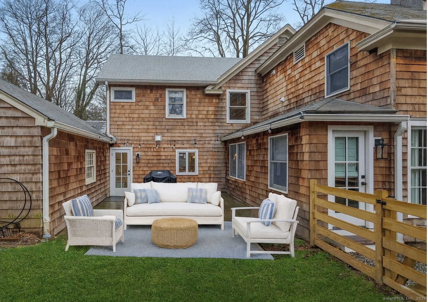 22 Harstrom Place Norwalk, CT 06853 - Photo 16 of 26 a view of a patio with couches chairs and a fire pit