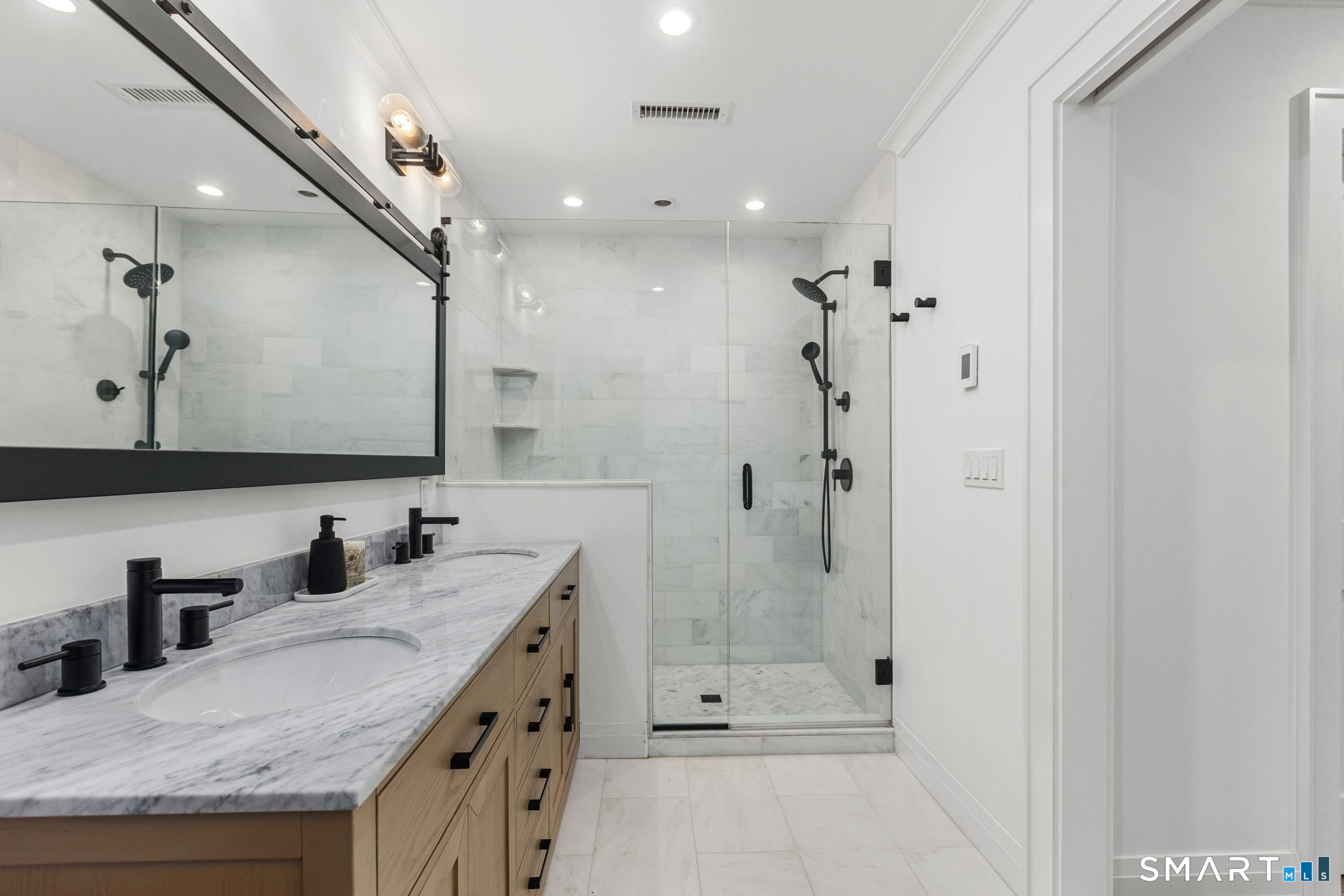 22 Harstrom Place Norwalk, CT 06853 - Photo 20 of 26 a bathroom with a granite countertop sink a mirror and shower