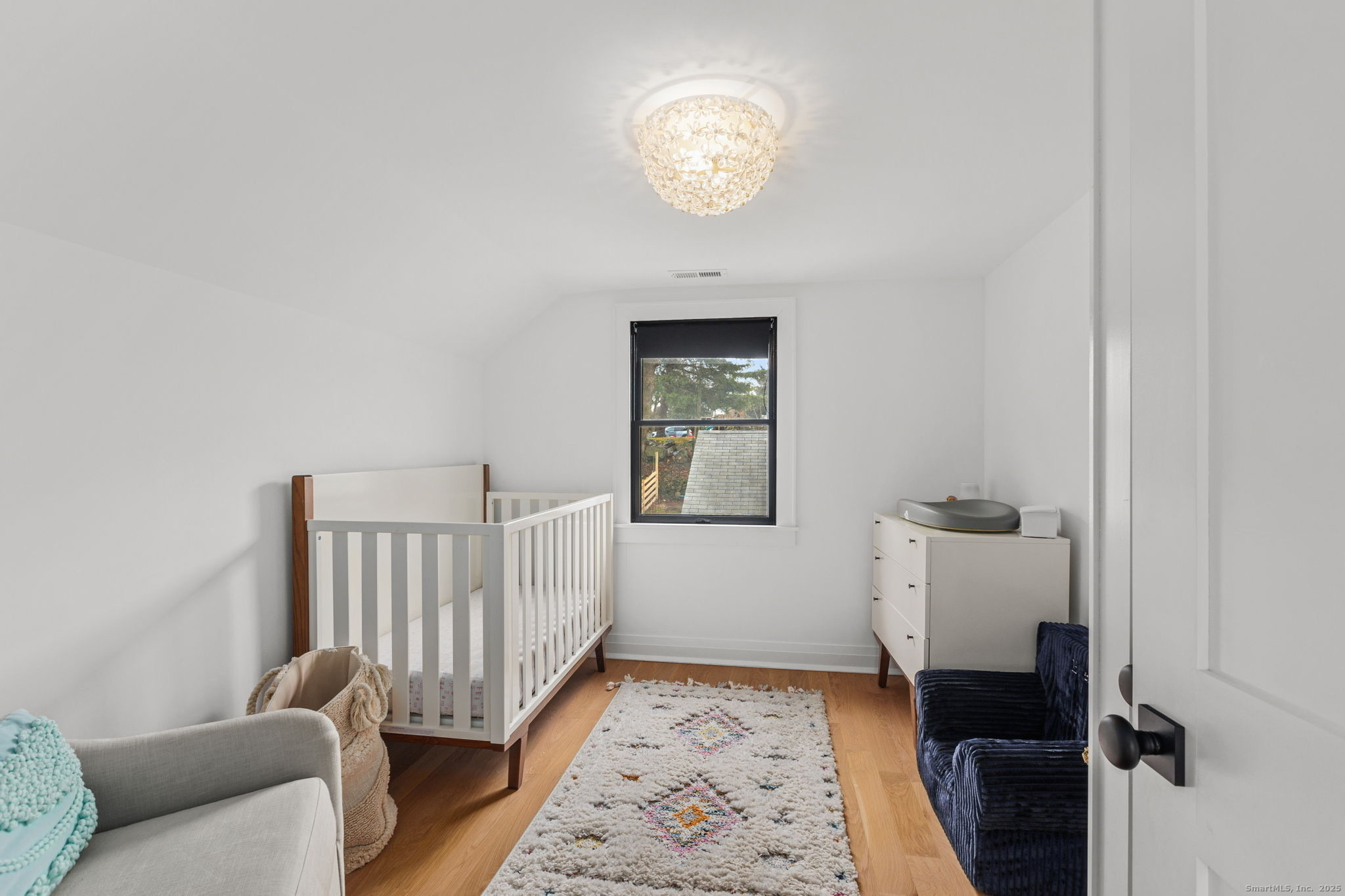 22 Harstrom Place Norwalk, CT 06853 - Photo 22 of 26 a view of a hallway with windows and stairs