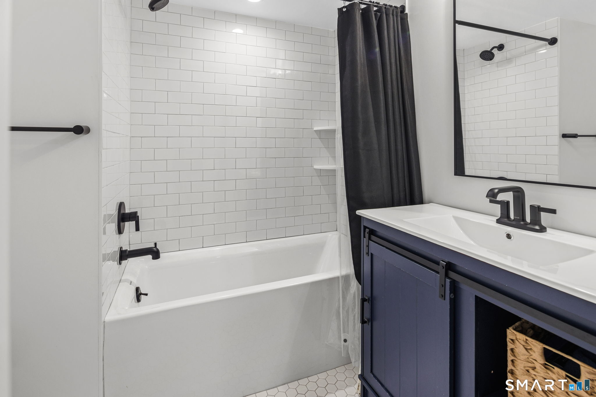 22 Harstrom Place Norwalk, CT 06853 - Photo 24 of 26 a bathroom with a bathtub and a sink