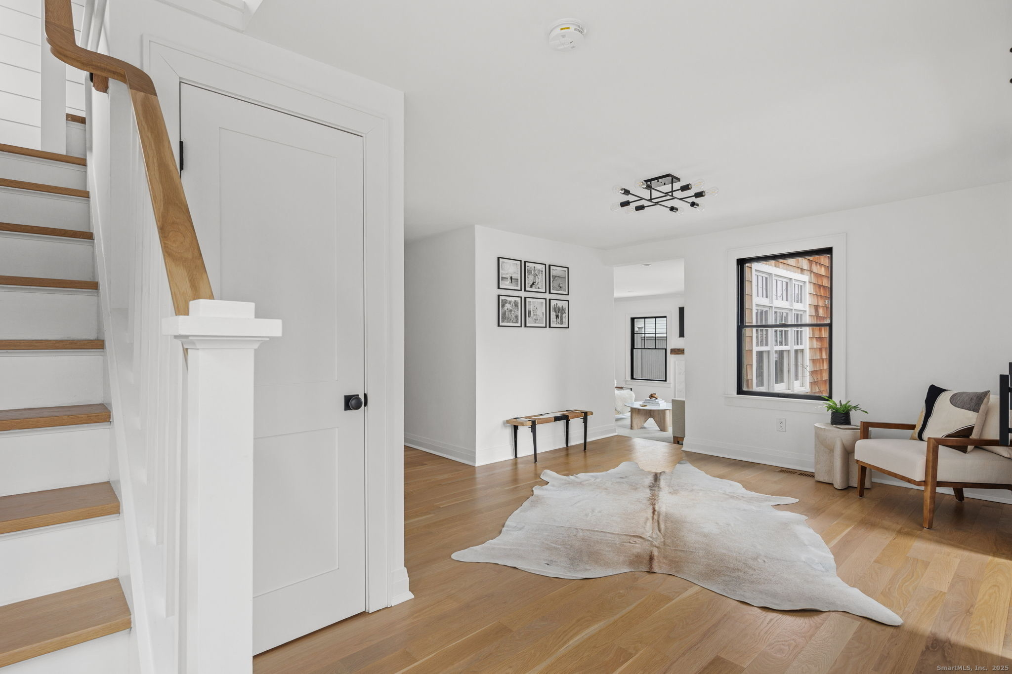 22 Harstrom Place Norwalk, CT 06853 - Photo 3 of 26 a living room with furniture and a wooden floor