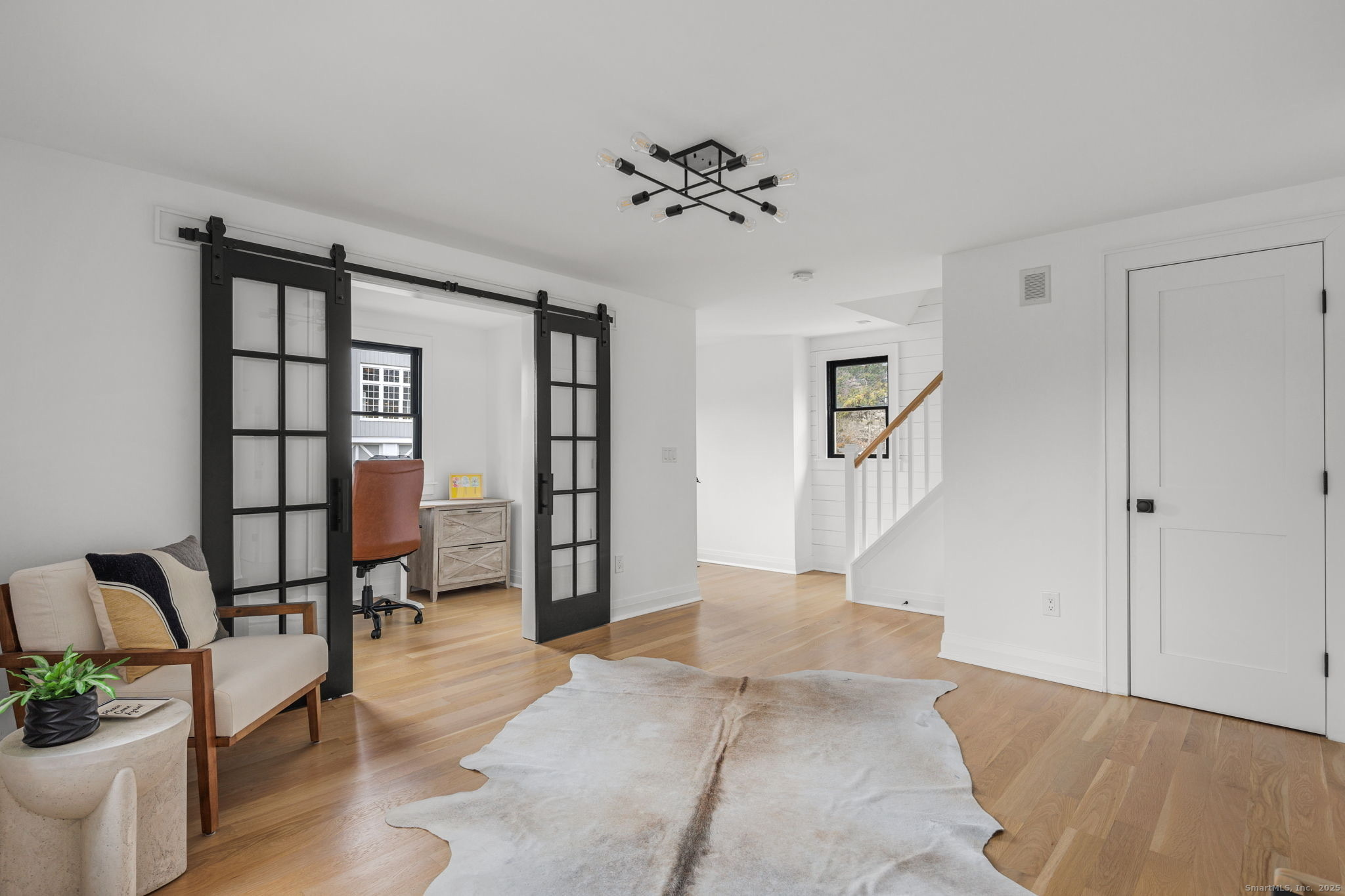 22 Harstrom Place Norwalk, CT 06853 - Photo 4 of 26 a view of a livingroom with a staircase