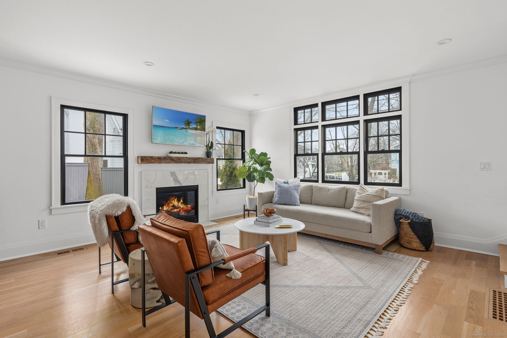 22 Harstrom Place Norwalk, CT 06853 - Photo 8 of 26 a living room with furniture and a fireplace