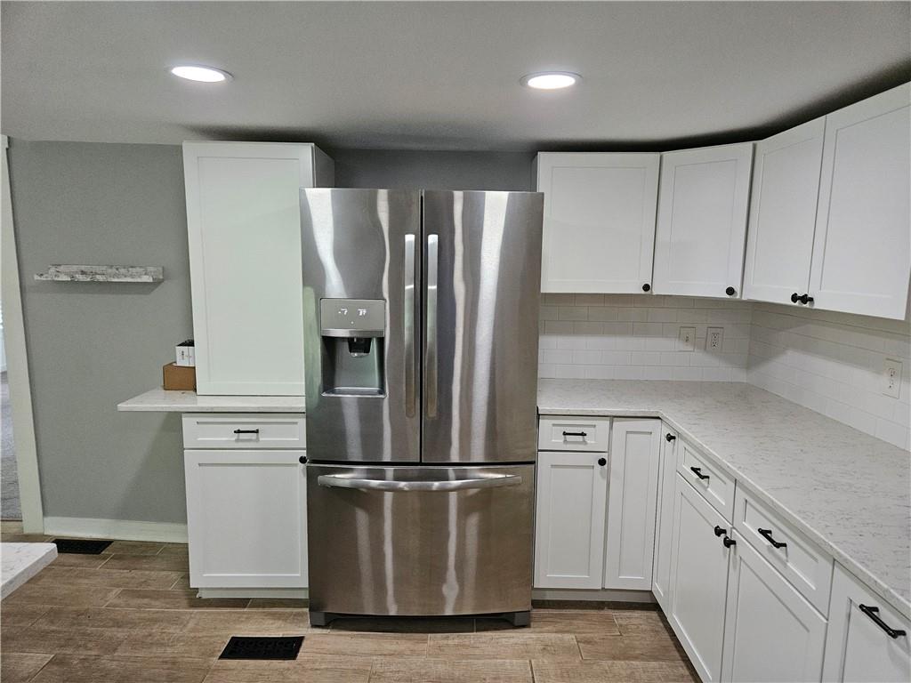 451 Buttermilk Hollow Road Irwin, PA 15642 - Photo 13 of 35 a kitchen with cabinets and stainless steel appliances