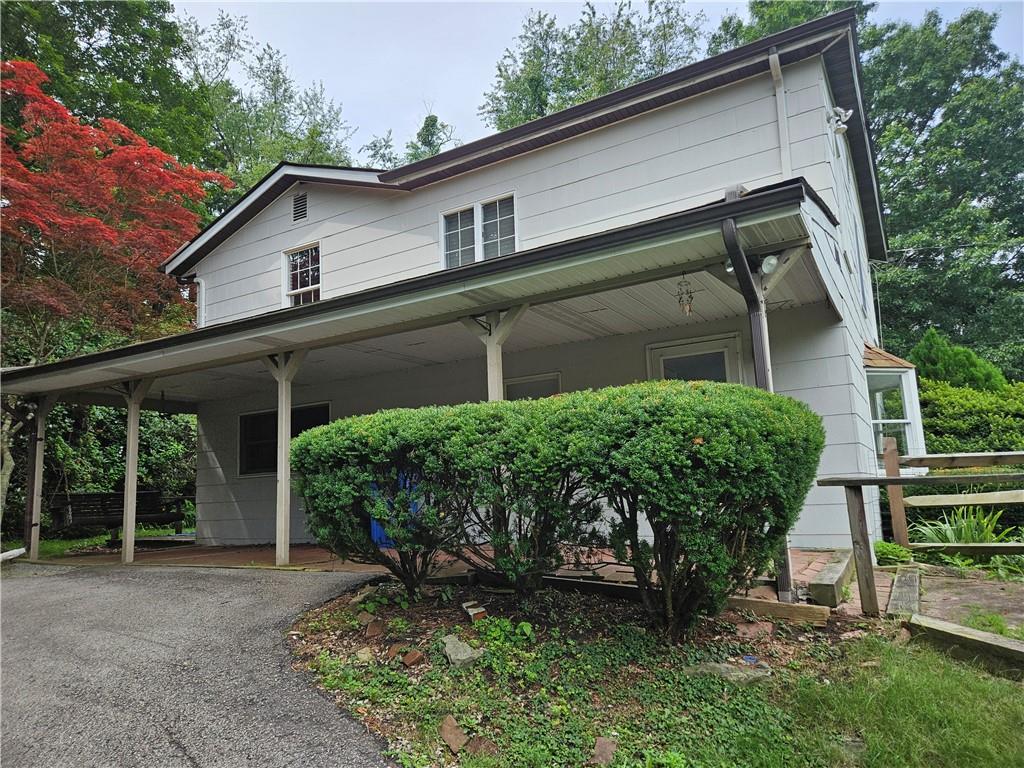 451 Buttermilk Hollow Road Irwin, PA 15642 - Photo 2 of 35 a front view of a house with garden