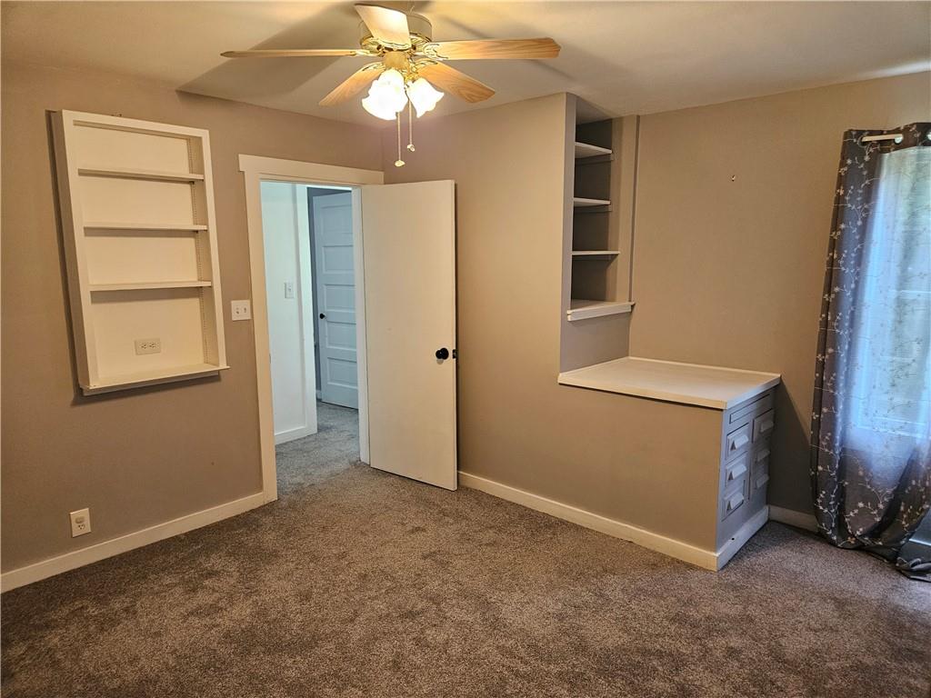 451 Buttermilk Hollow Road Irwin, PA 15642 - Photo 24 of 35 an empty room with windows and cabinet