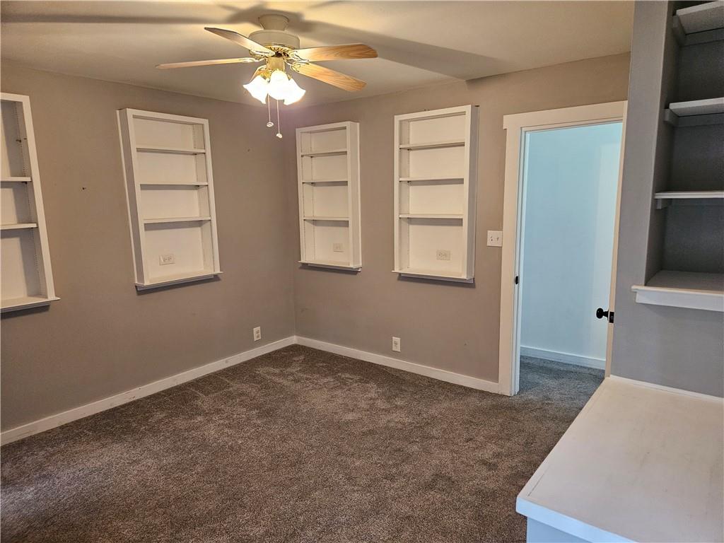 451 Buttermilk Hollow Road Irwin, PA 15642 - Photo 25 of 35 a view of an empty room with window and cabinet