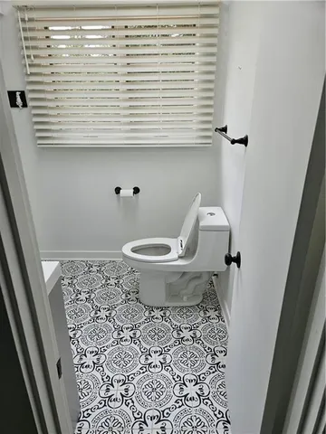 a bathroom with a shower and a sink