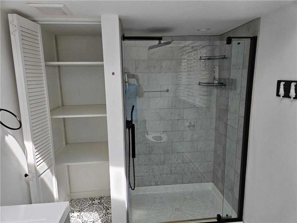 451 Buttermilk Hollow Road Irwin, PA 15642 - Photo 29 of 35 a bathroom with a shower and a sink