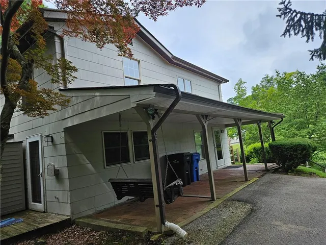 a house with trees in front of it