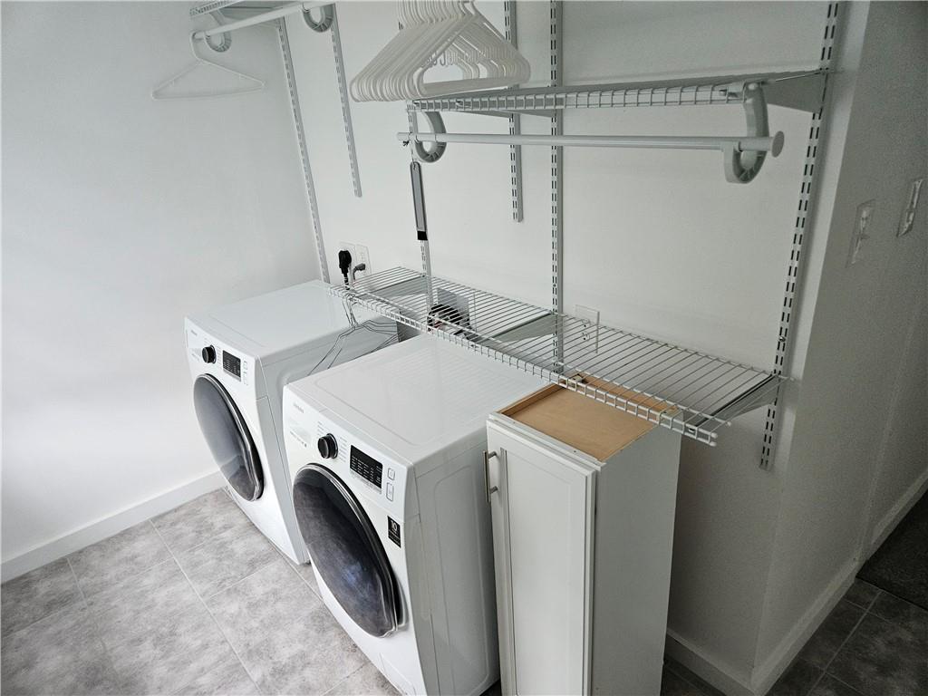 451 Buttermilk Hollow Road Irwin, PA 15642 - Photo 35 of 35 a utility room with dryer and washer