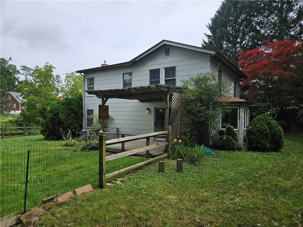 451 Buttermilk Hollow Road Irwin, PA 15642 - Photo 5 of 35 a front view of a house with a garden