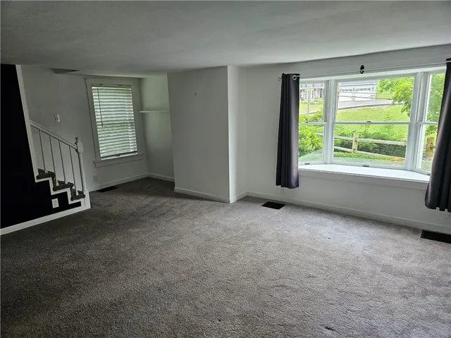 a view of an empty room and window