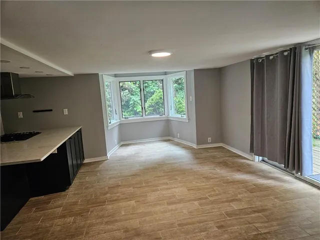 a kitchen with kitchen island cabinets and refrigerator