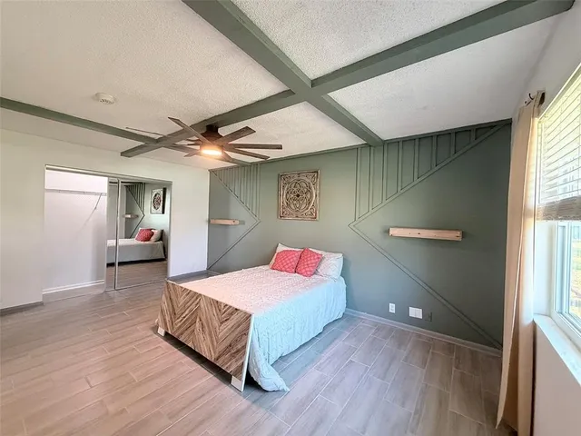 a bedroom with a bed and window