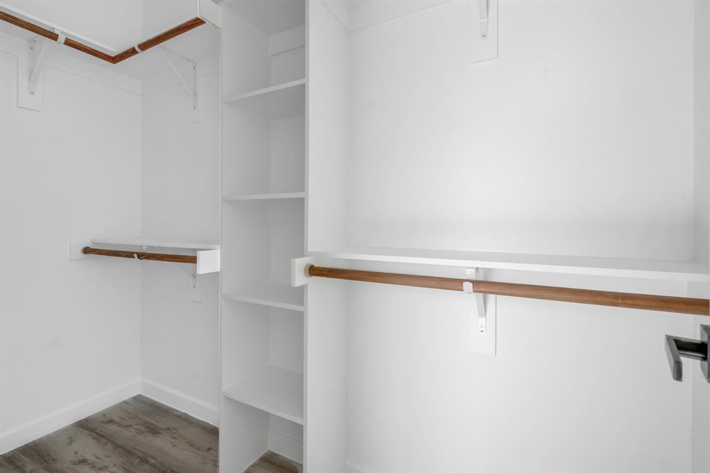 948 Corinth Street, Unit 5 Dallas, TX 75215 - Photo 24 of 28 Walk in closet featuring wood finished floors