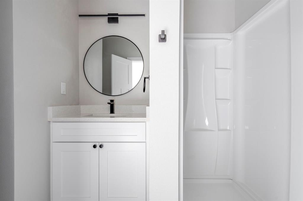 948 Corinth Street, Unit 5 Dallas, TX 75215 - Photo 26 of 28 Full bathroom with vanity and a shower stall